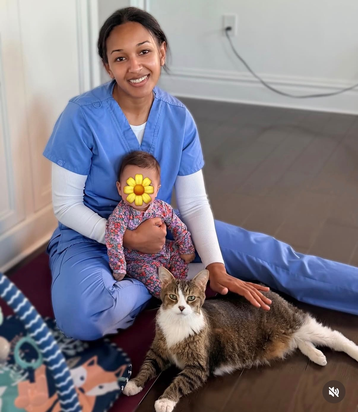 Peterlyn with a baby and a cat