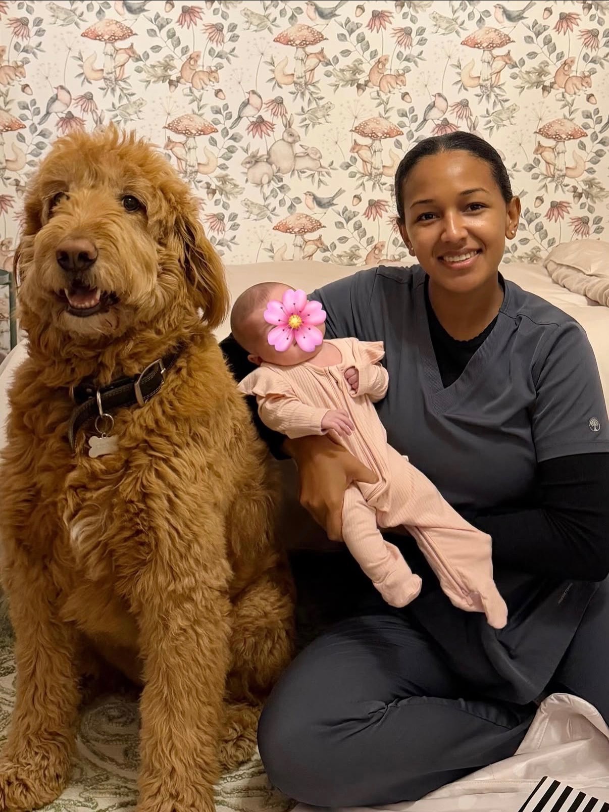 Peterlyn with a newborn and a golden doodle